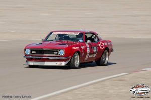 Red Apex Camaro on track LVMS outside road course OUSCI