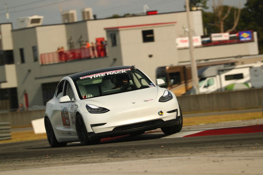 John Laughlin Tesla Model 3 road course curb