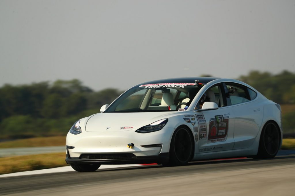 John Laughlin Tesla Model 3 road course dark